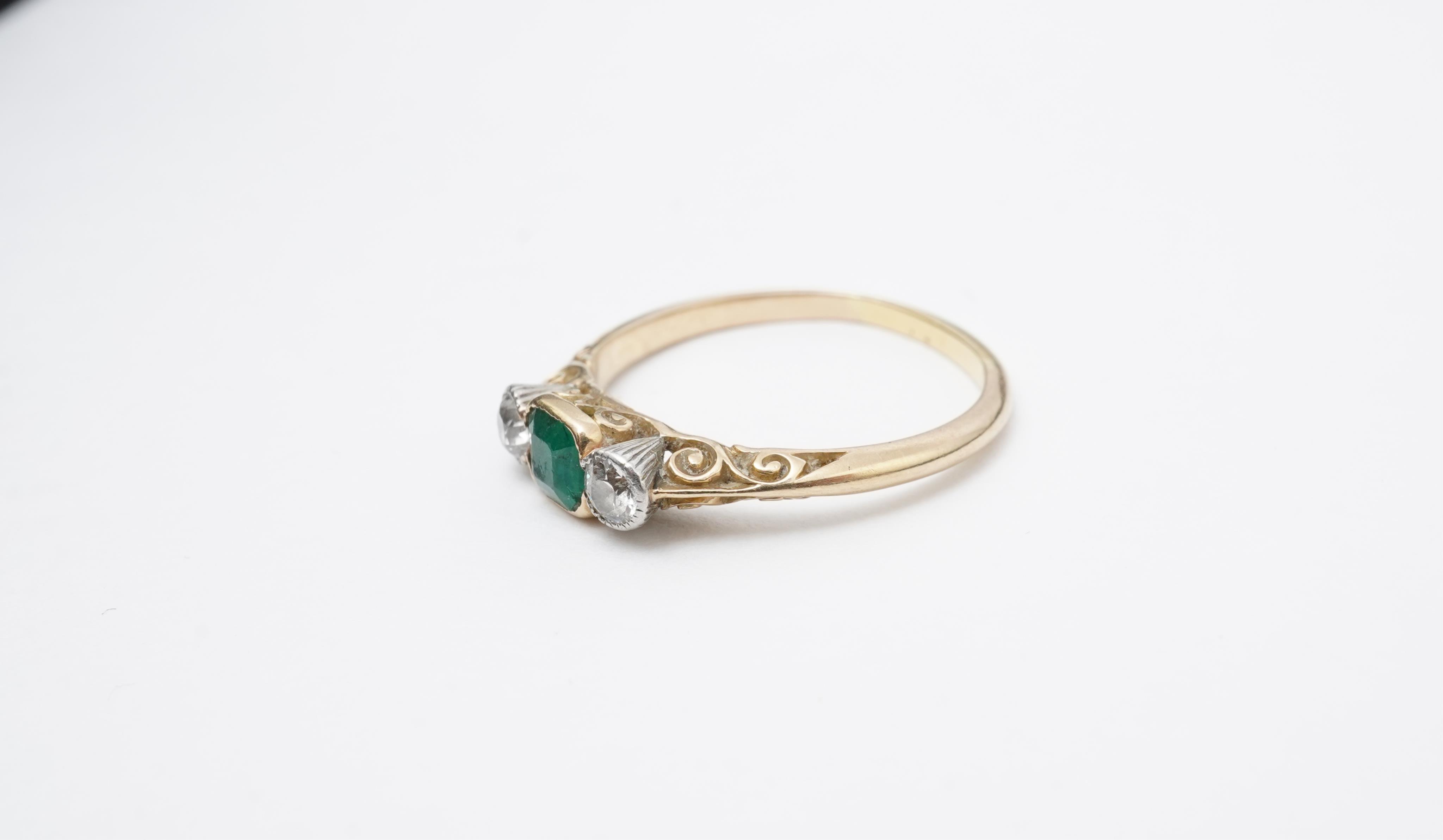 An emerald and diamond ring, early 20th century